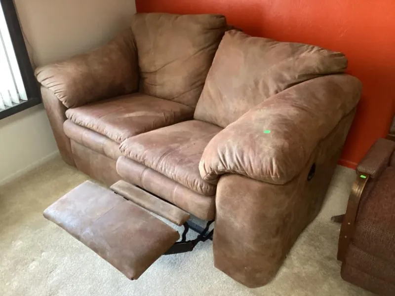 Brown reclining loveseat