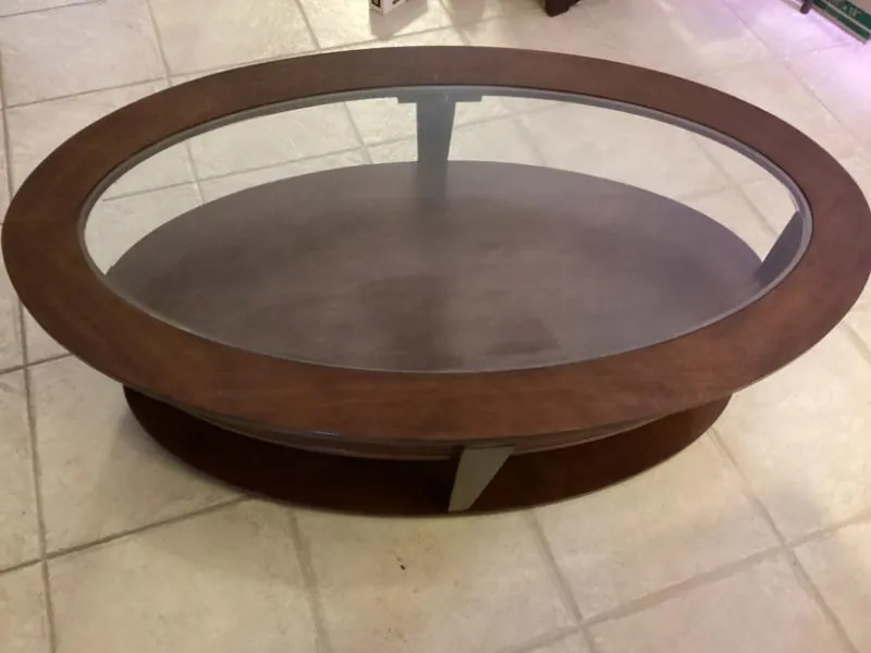Oval glass-top coffee table