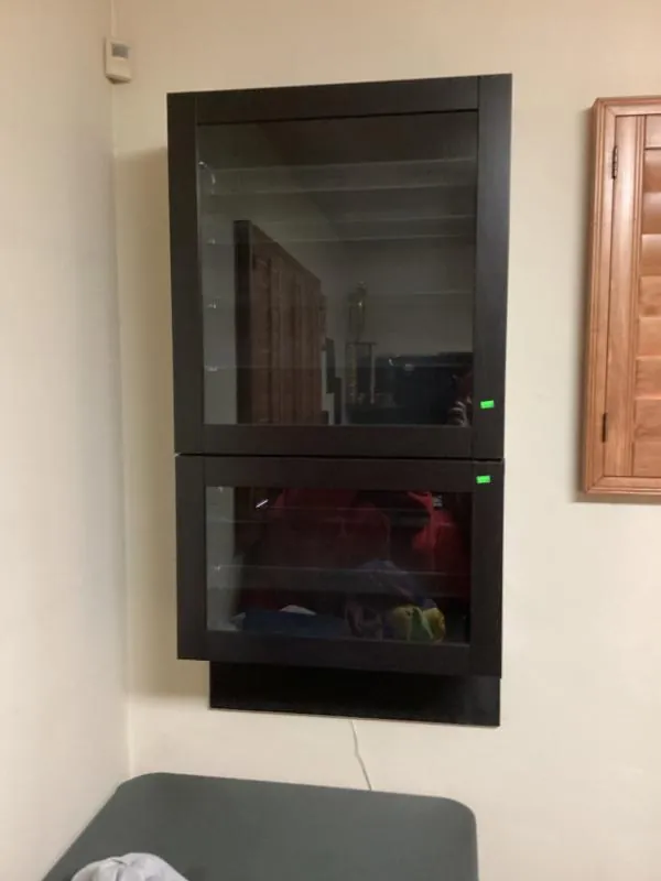 Black wall cabinet with glass doors