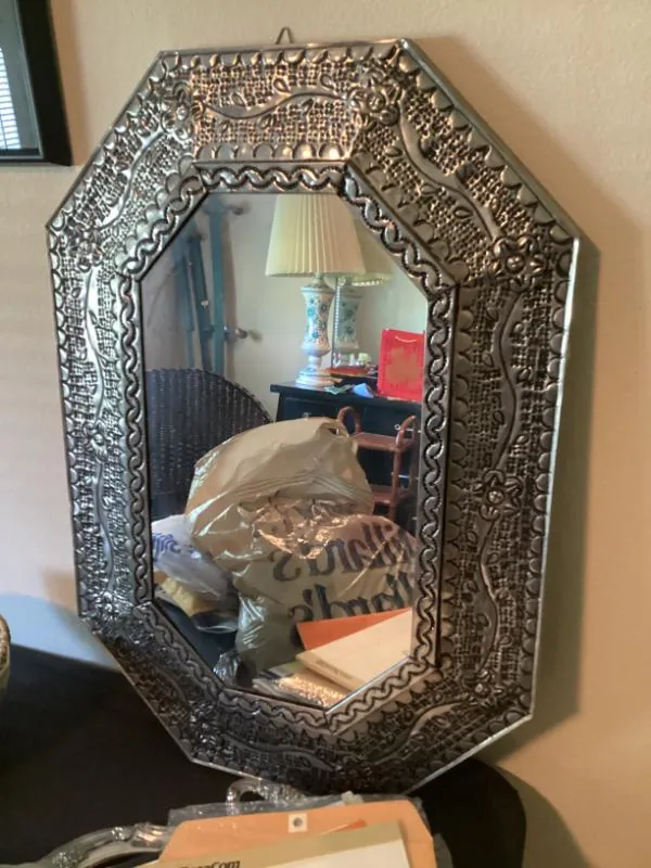 Ornate octagonal metal mirror