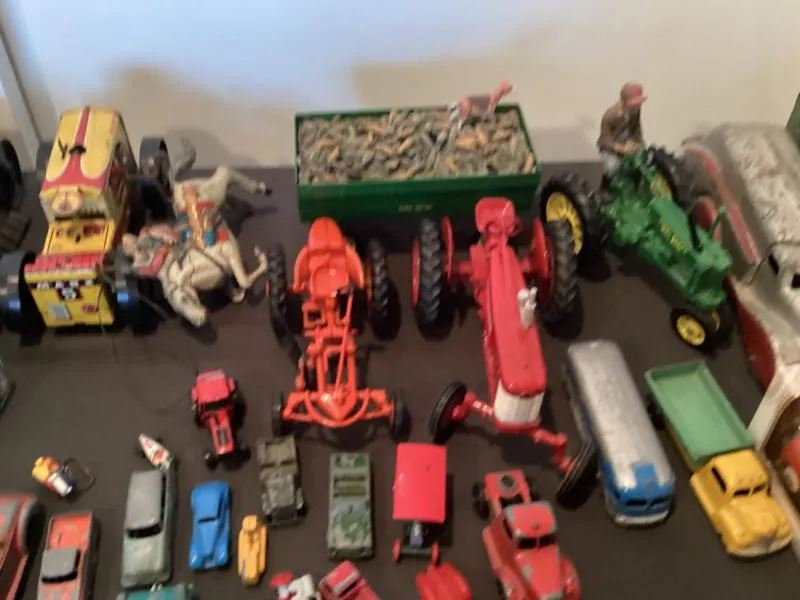 Collection of toy tractors and trucks