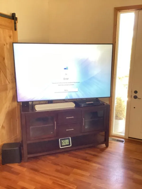 Flat-screen TV on a wood TV console