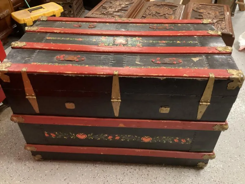 Painted black and red steamer trunk