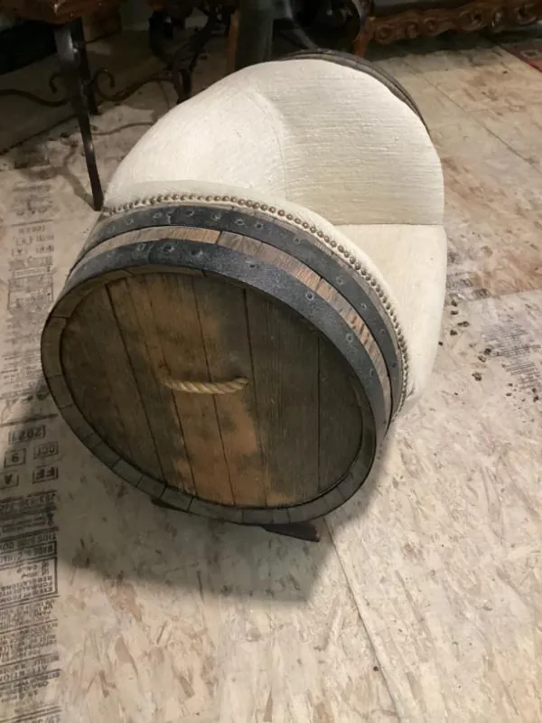Wine barrel chair with a cream cushion
