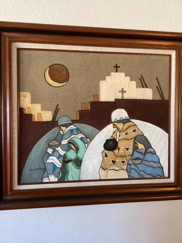 Framed Southwestern painting of figures near a church