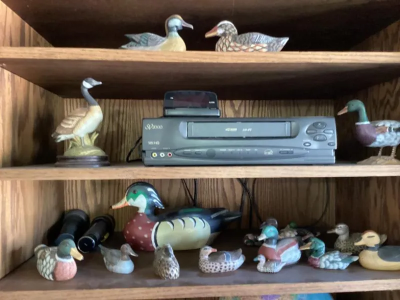 Shelf of carved duck decoys