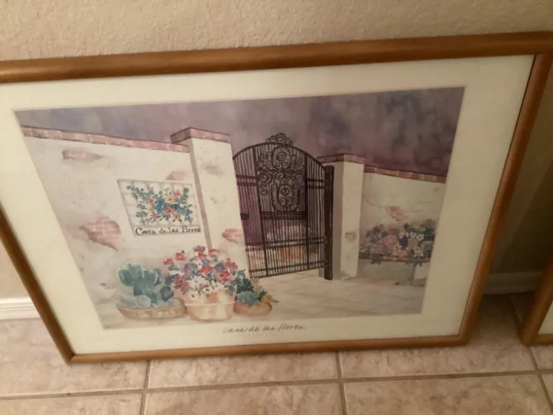 Framed print of a garden gate with flowers