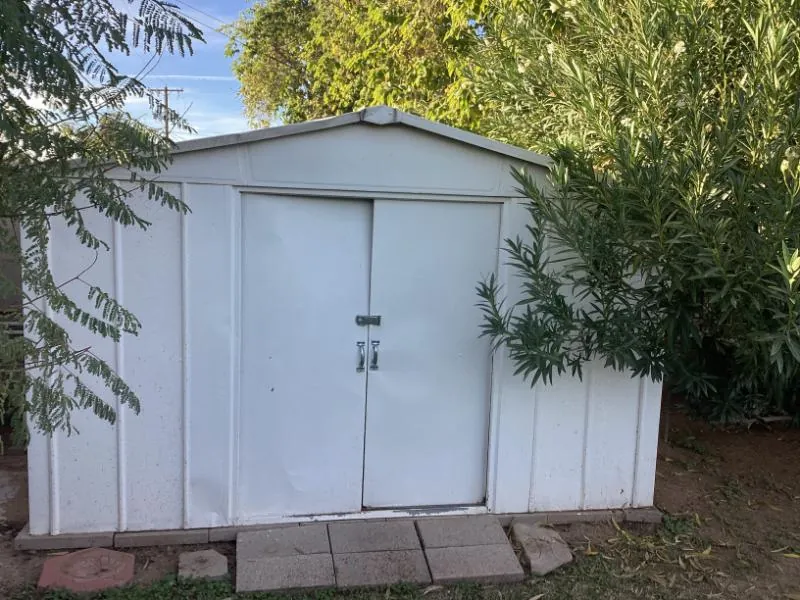 White metal storage shed