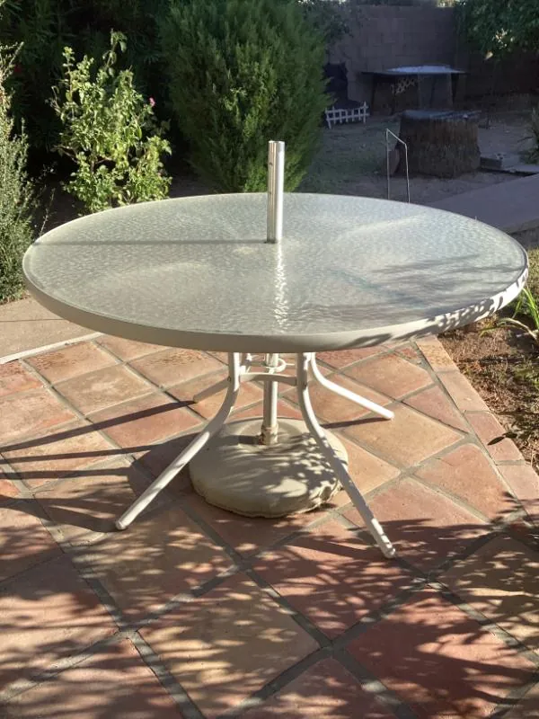 Round glass patio table