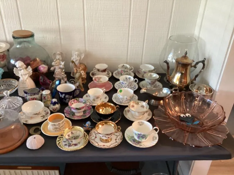 Table of teacups, saucers and teapots