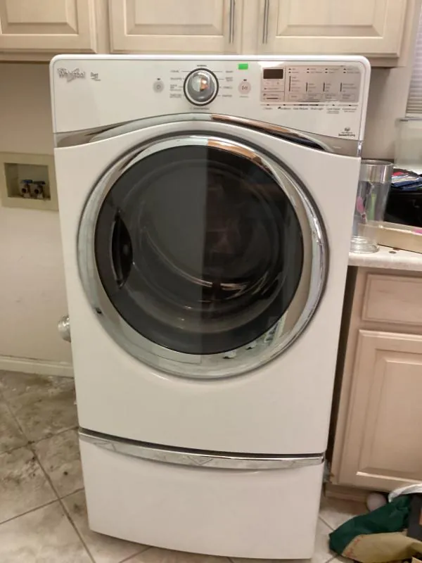 Whirlpool front-load washer on a pedestal