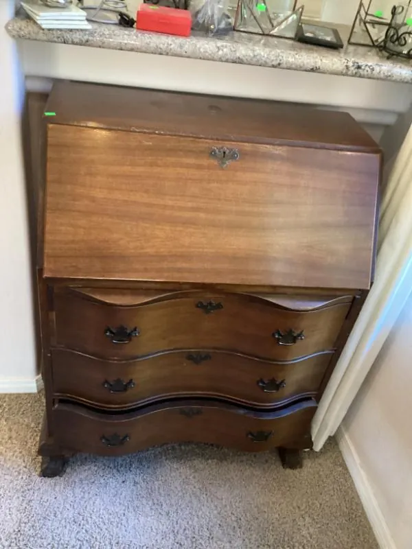 Wood secretary desk with drawers and carved feet