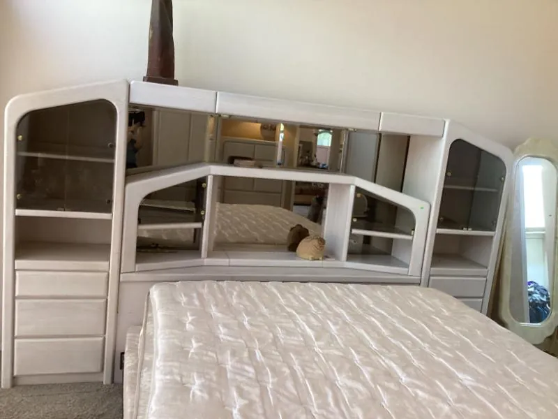 White bedroom wall unit with mirrors