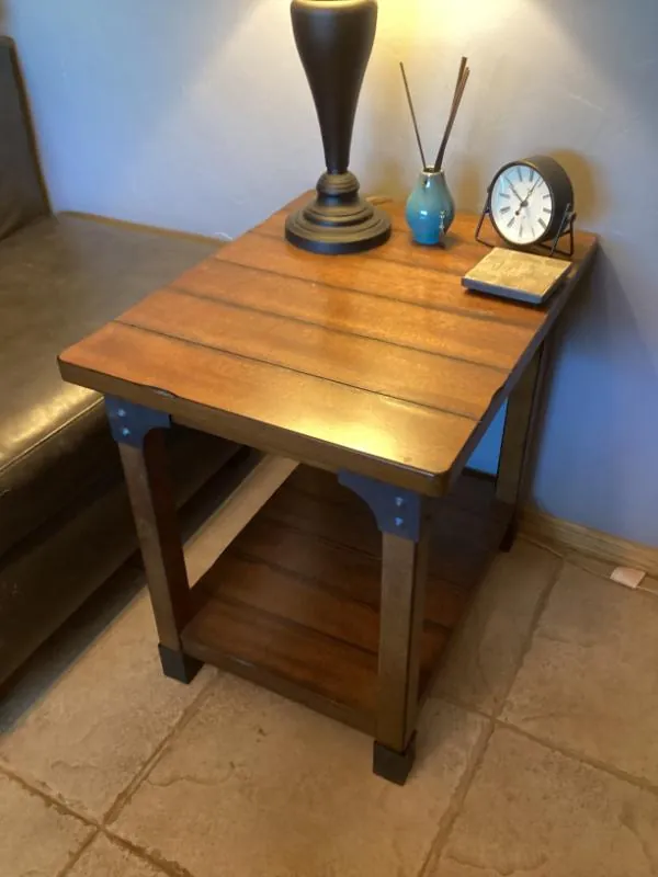 Wood end table with a lamp and clock