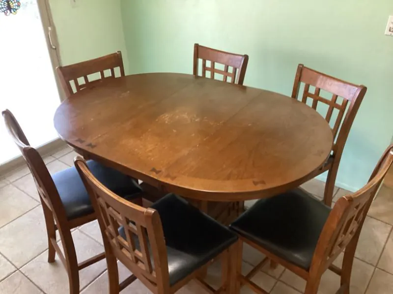 Round wood dining table with chairs