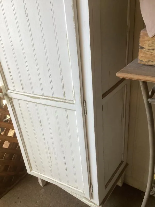 White wood cabinet with wine rack shelves