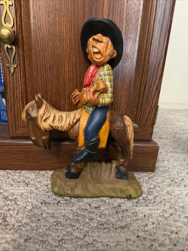 Cowboy figurine riding a horse