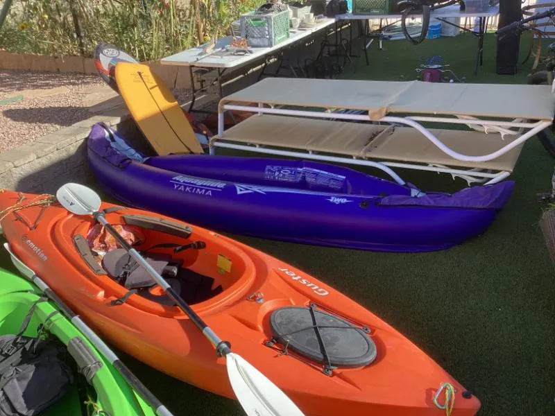 Colorful kayaks on artificial grass