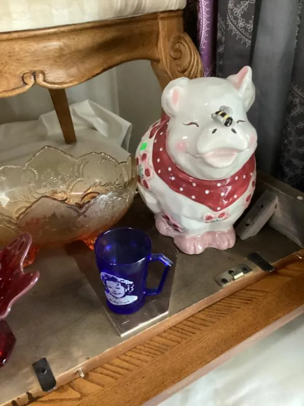 Pig figurine wearing a red bandana