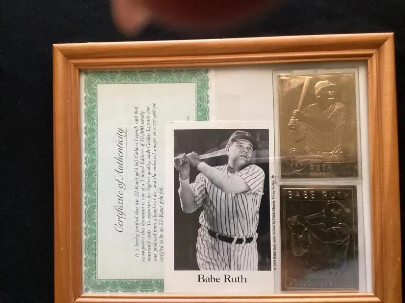 Framed Babe Ruth photo with a certificate of authenticity