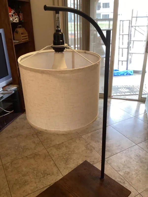 Small side table with an attached lamp