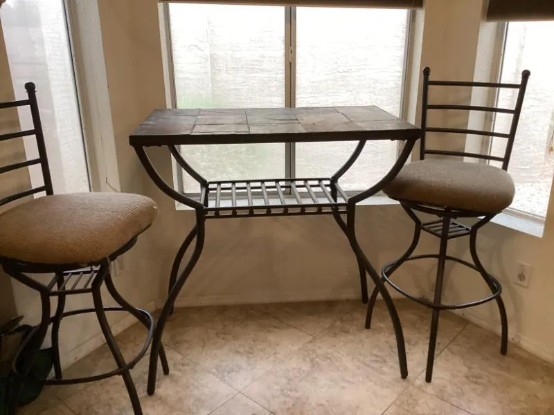 Pub table with two swivel bar stools