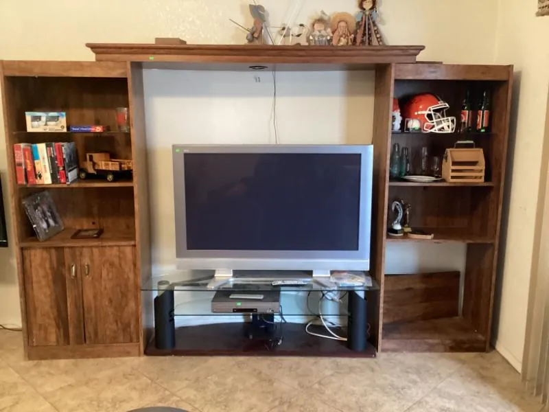Wood entertainment center with a TV