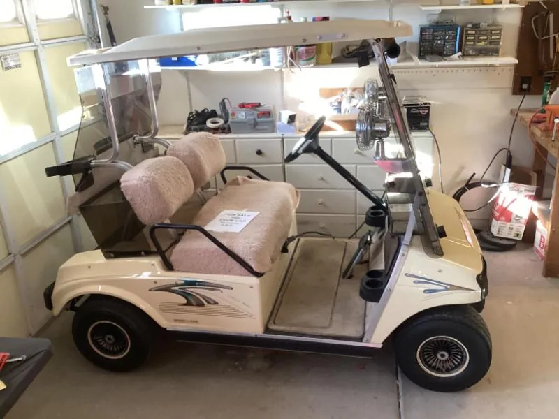 White golf cart in a garage