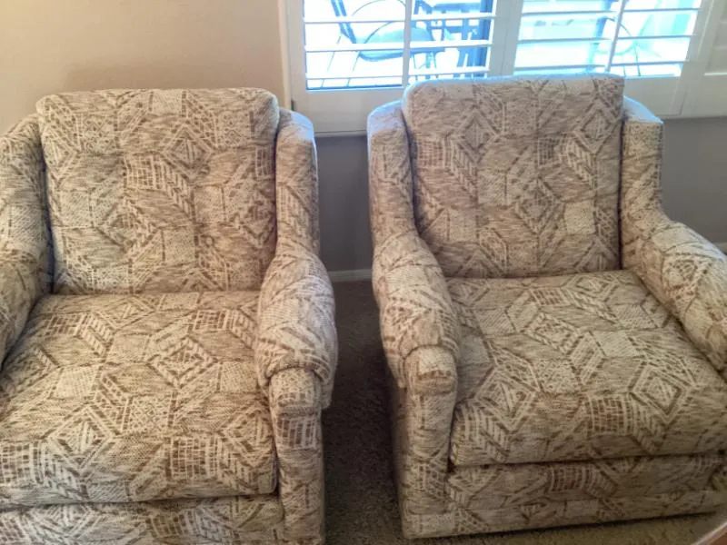 Pair of upholstered swivel chairs