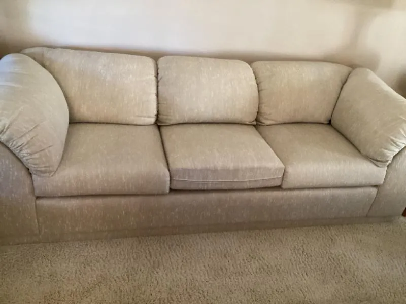 Beige three-cushion sofa