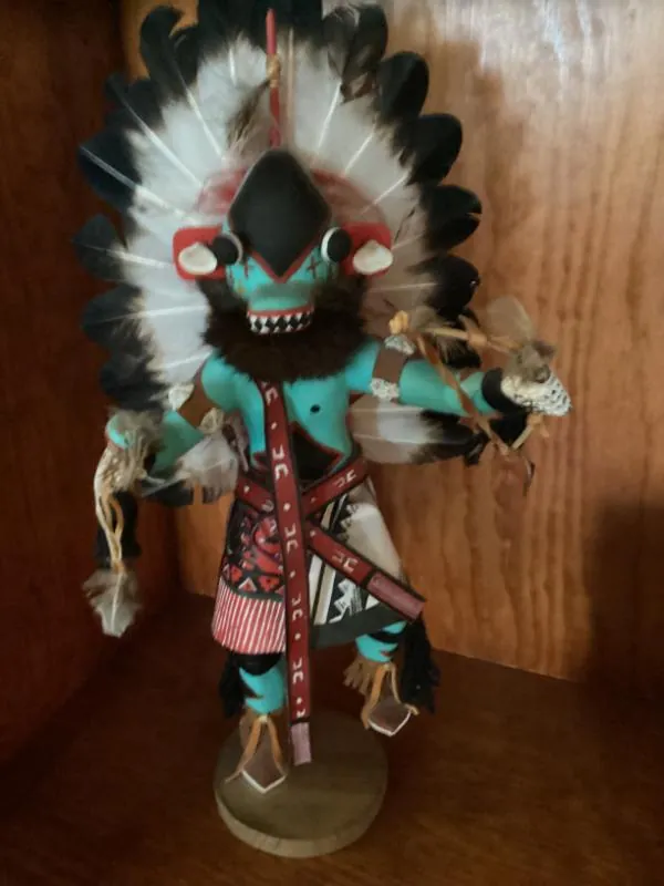 Kachina-style figure with feathers