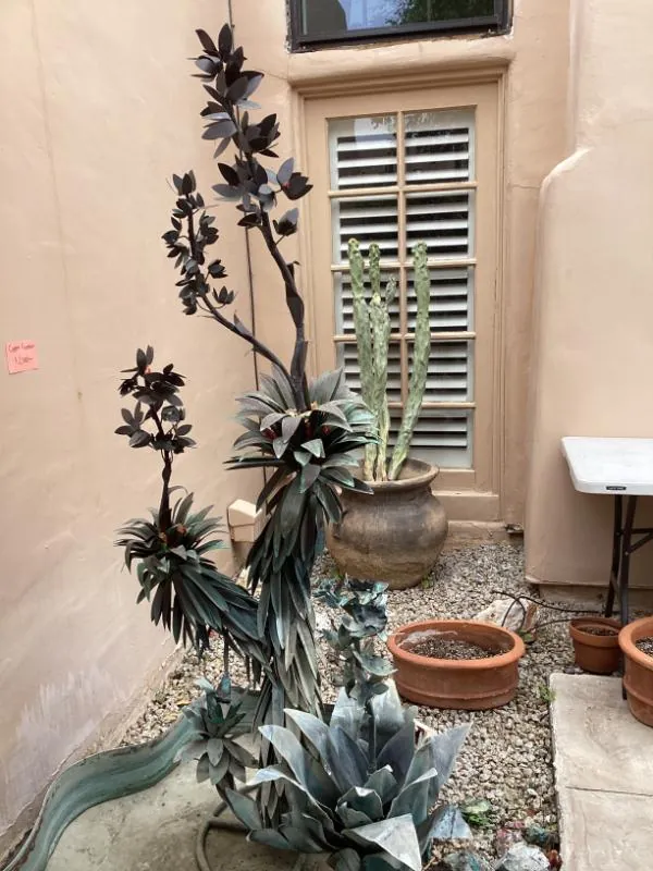 Metal desert-plant sculpture in a courtyard