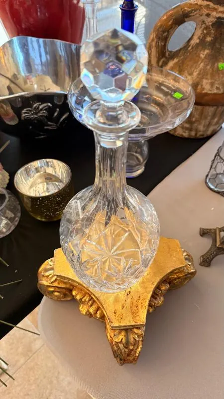 Cut-glass decanter on a gold stand