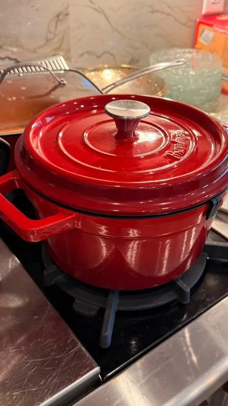 Red Dutch oven on a stovetop