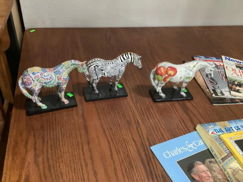 Painted horse figurines on a table
