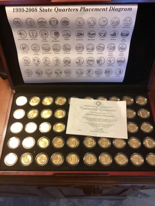 Framed set of gold-colored state quarters with its placement diagram