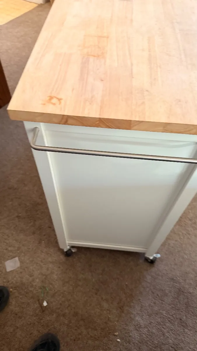 White kitchen cart with a butcher-block top
