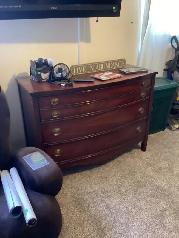 Wood dresser with decor on top