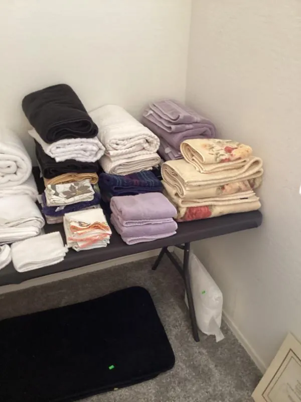 Table of folded linens and towels