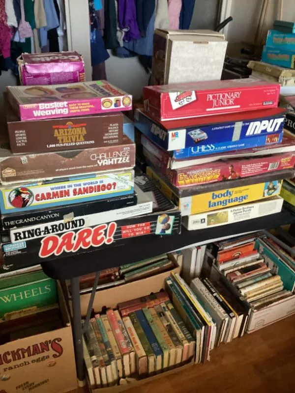 Stacks of board games and puzzles