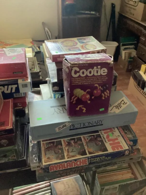Cootie game box on top of a stack of games