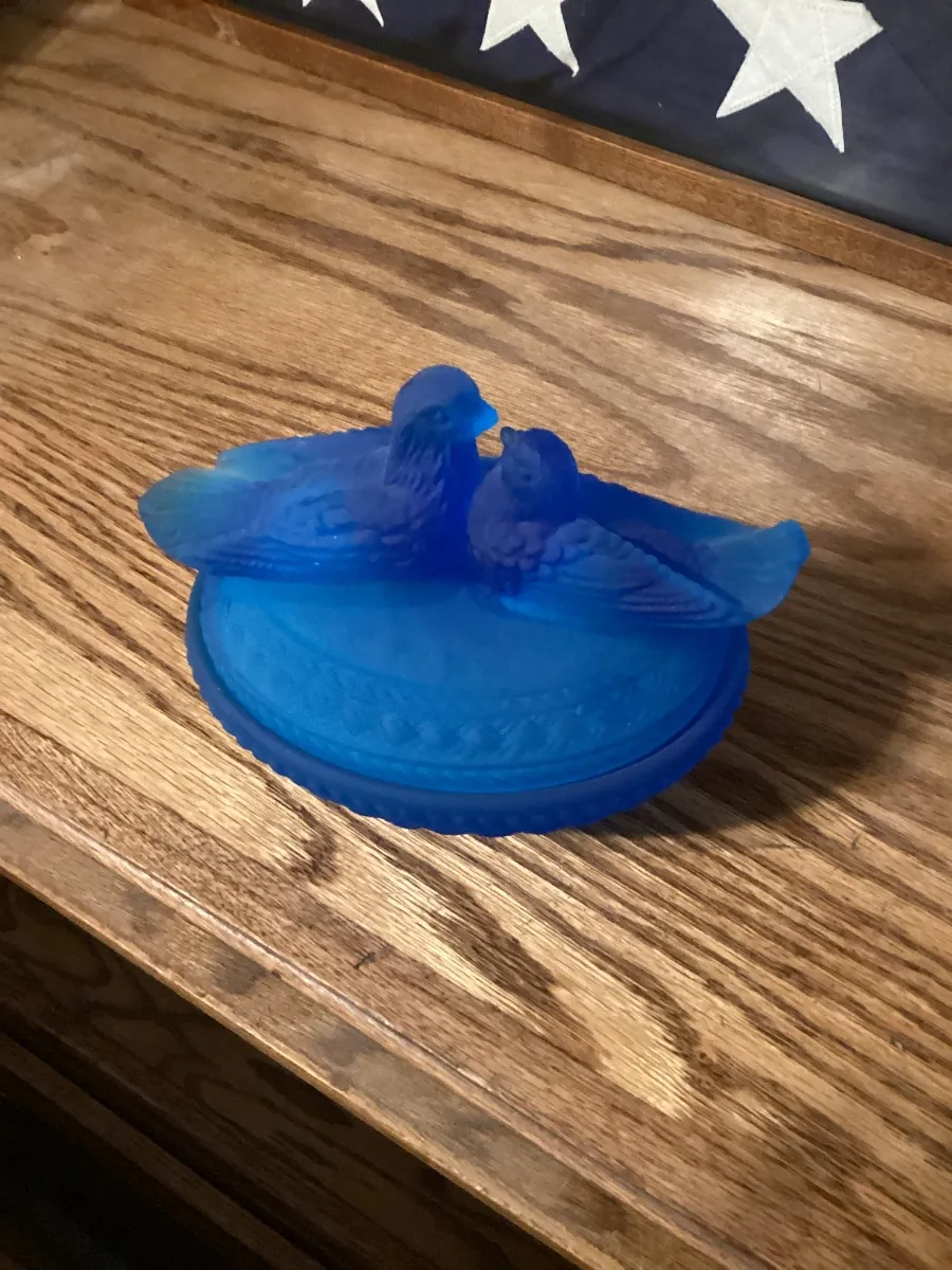 Blue glass covered dish with birds on the lid