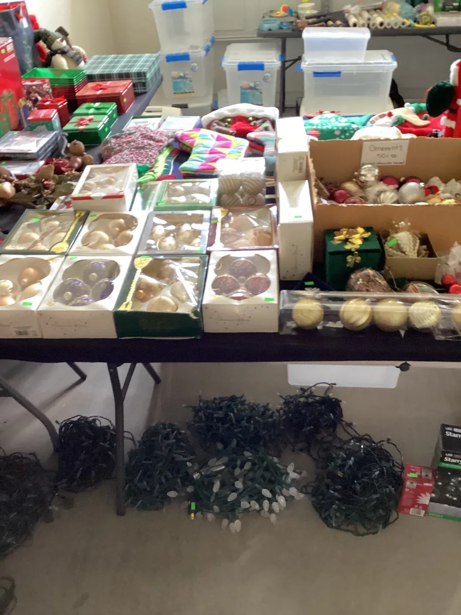 Tables of Christmas ornaments and holiday decor