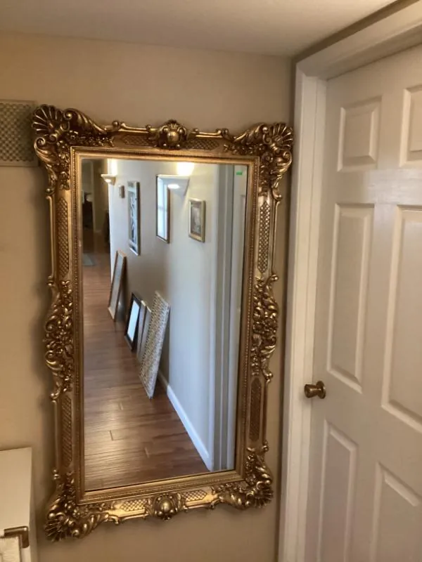 Large gold-framed mirror