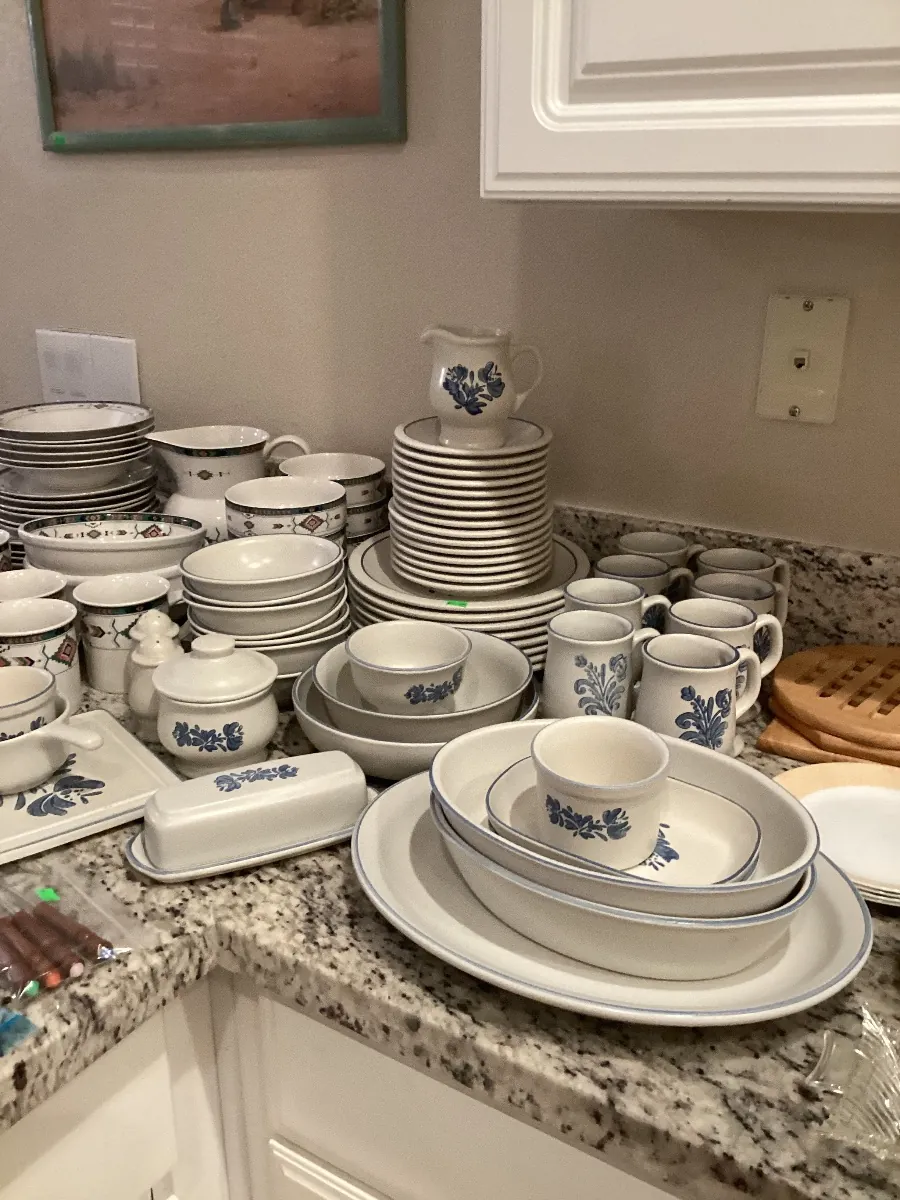 Kitchen counter covered with blue and white dishes