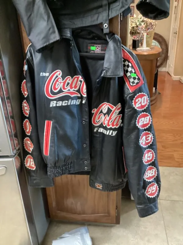 Black leather Coca-Cola Racing jacket with numbered patches on the sleeves