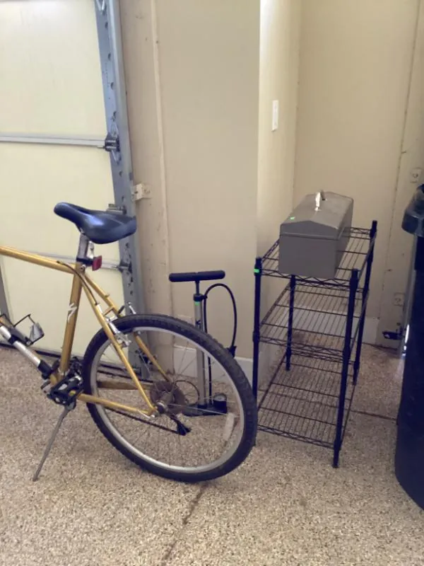 Gold-colored bicycle in a garage