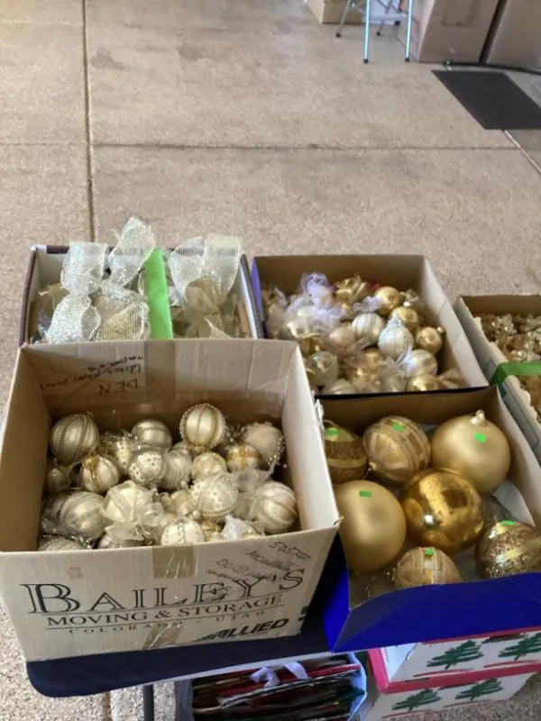 Boxes of gold and white Christmas ornaments