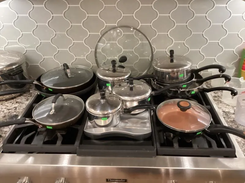 Cooktop covered with pots and pans