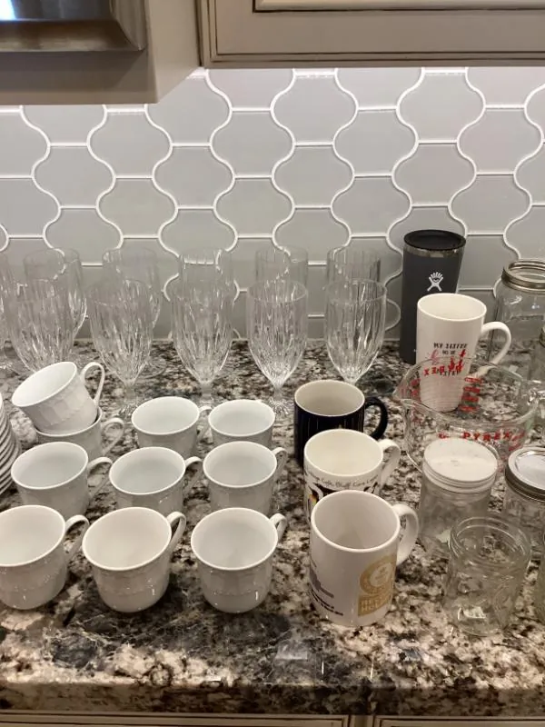Counter of coffee mugs and glassware
